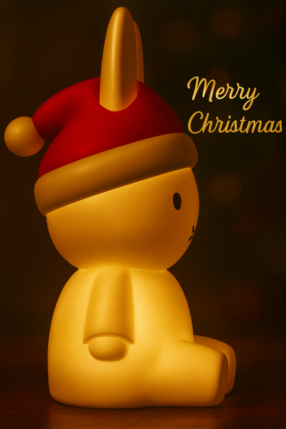Yellow character wearing a red Santa hat with 'Merry Christmas' text on a dark background